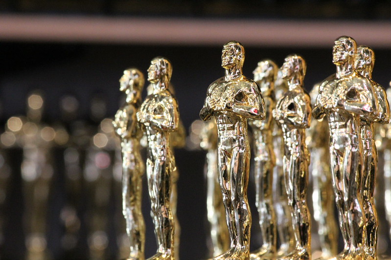 Hollywood Boulevard at night with neon signs and pedestrians on the famous street