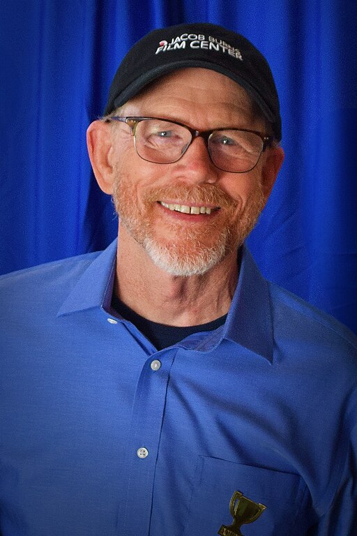 Ron Howard at 2023 event wearing blue shirt and Jacob Center cap