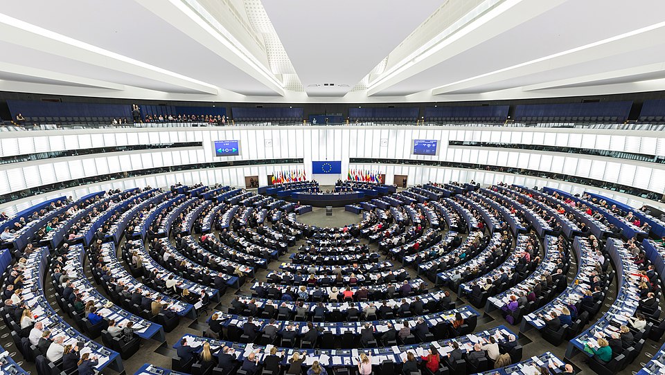 The hemicycle of the European Parliament in Strasbourg, where the EU AI Act was debated and voted into law