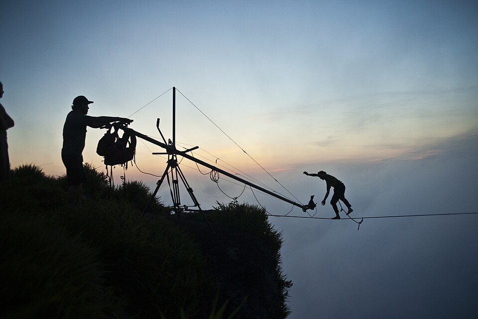 A filmmaker and crew member working on a film production set