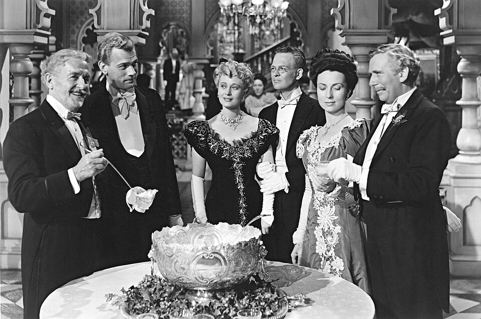 Scene from The Magnificent Ambersons featuring cast members in period costume