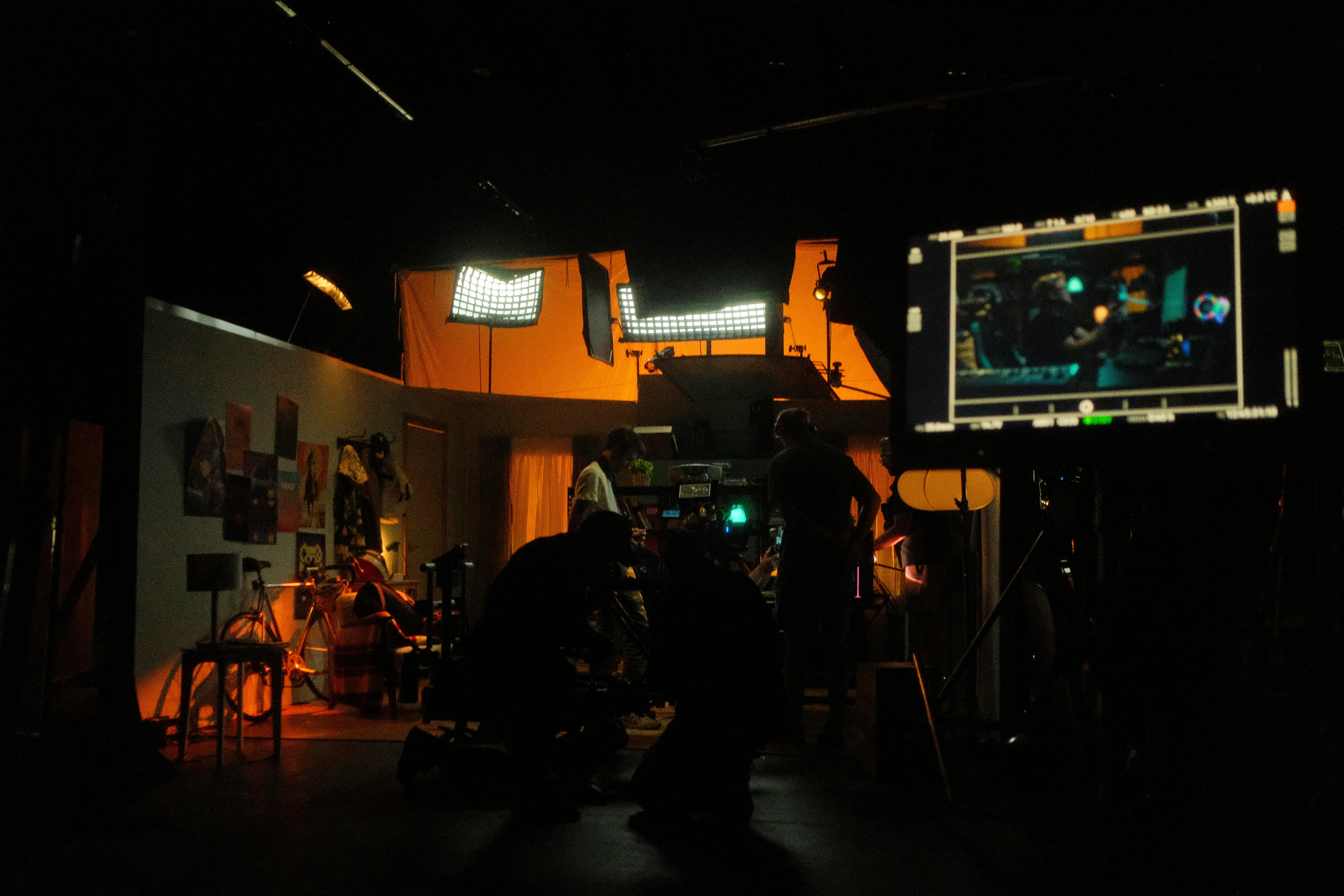 Film production crew working on set with professional equipment