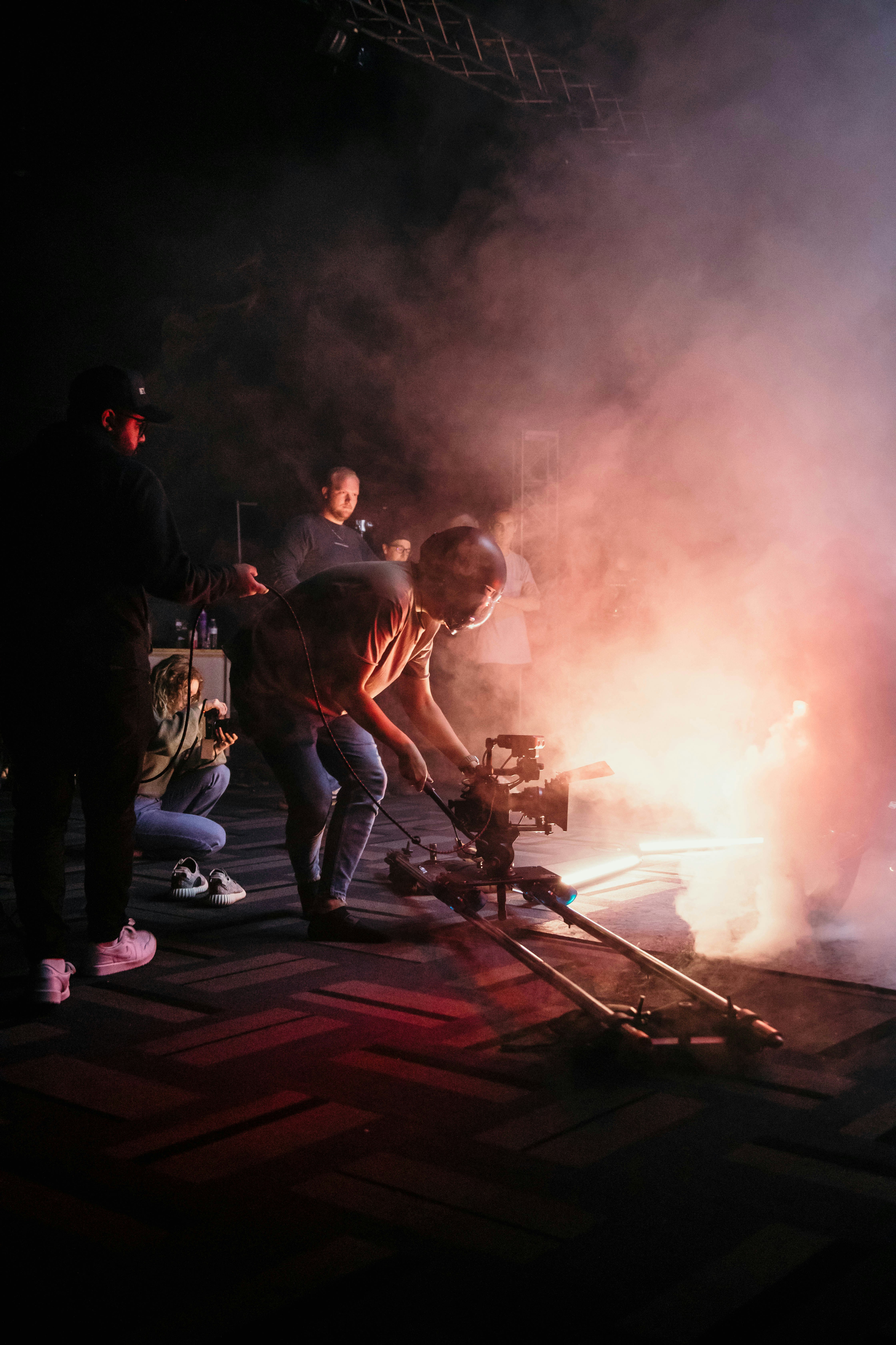 Group of people gathered around a fire at night