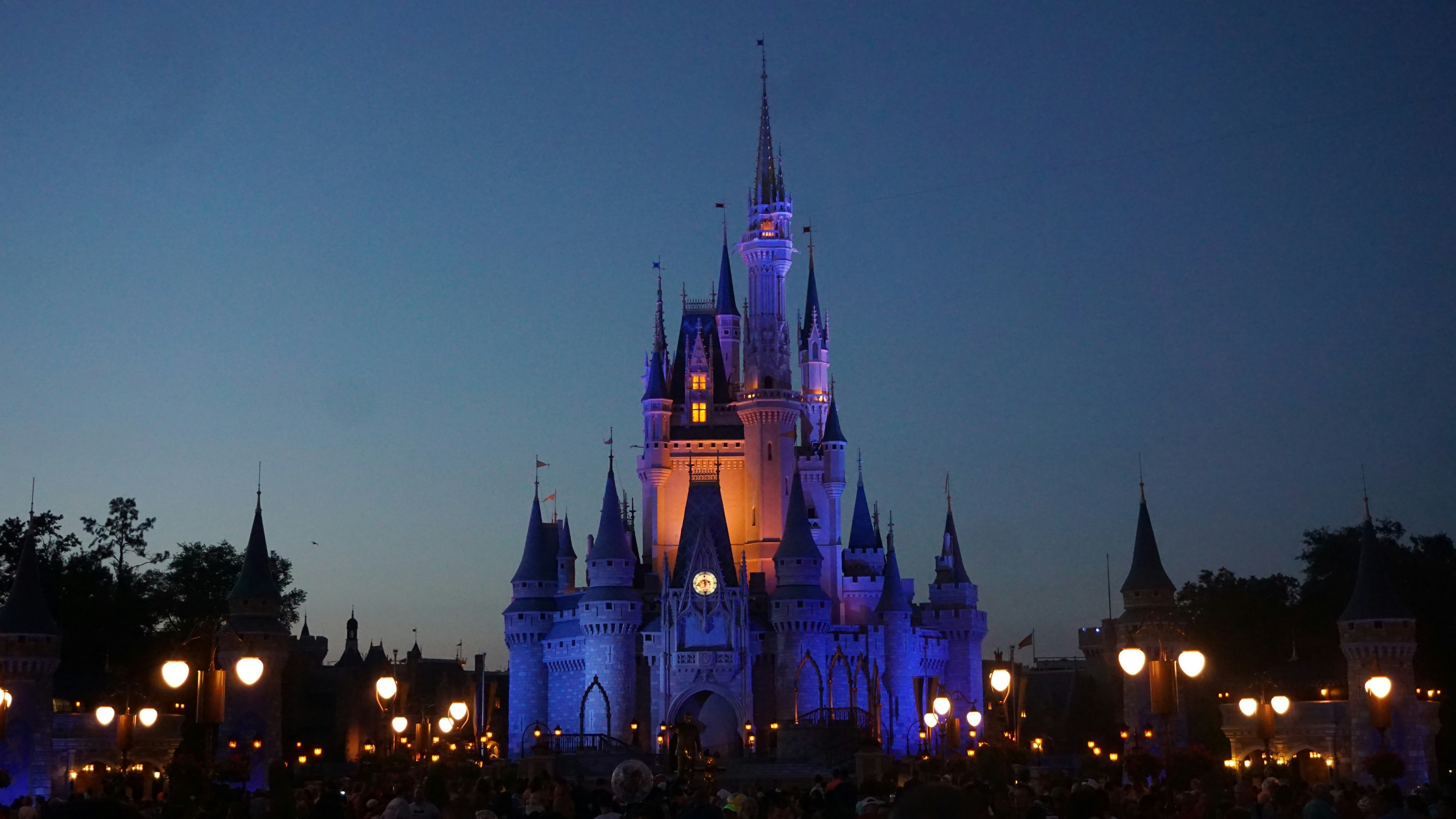 Illuminated Disney castle at night, representing the entertainment empire Eisner built over two decades