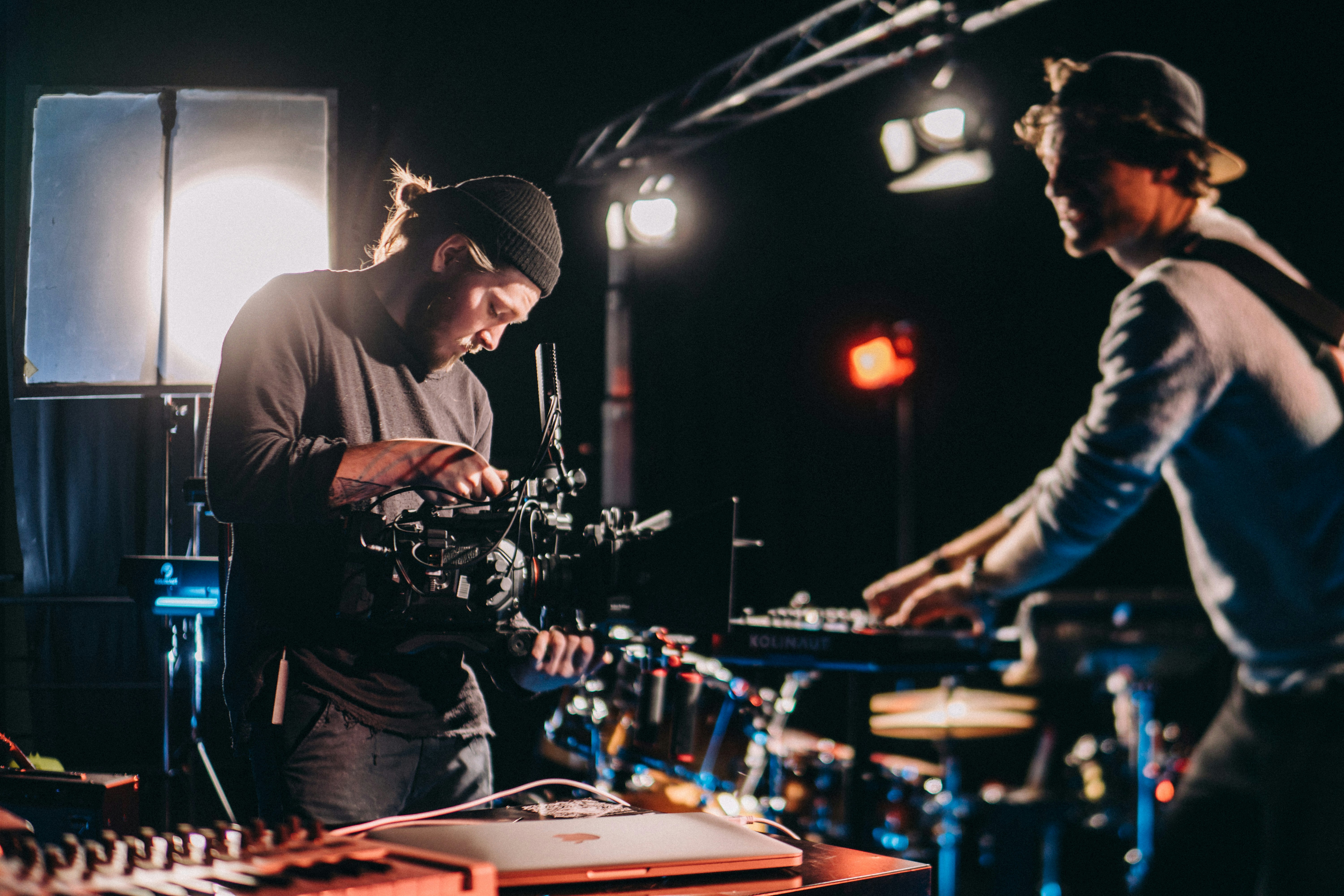 Filmmaker operating camera on professional set