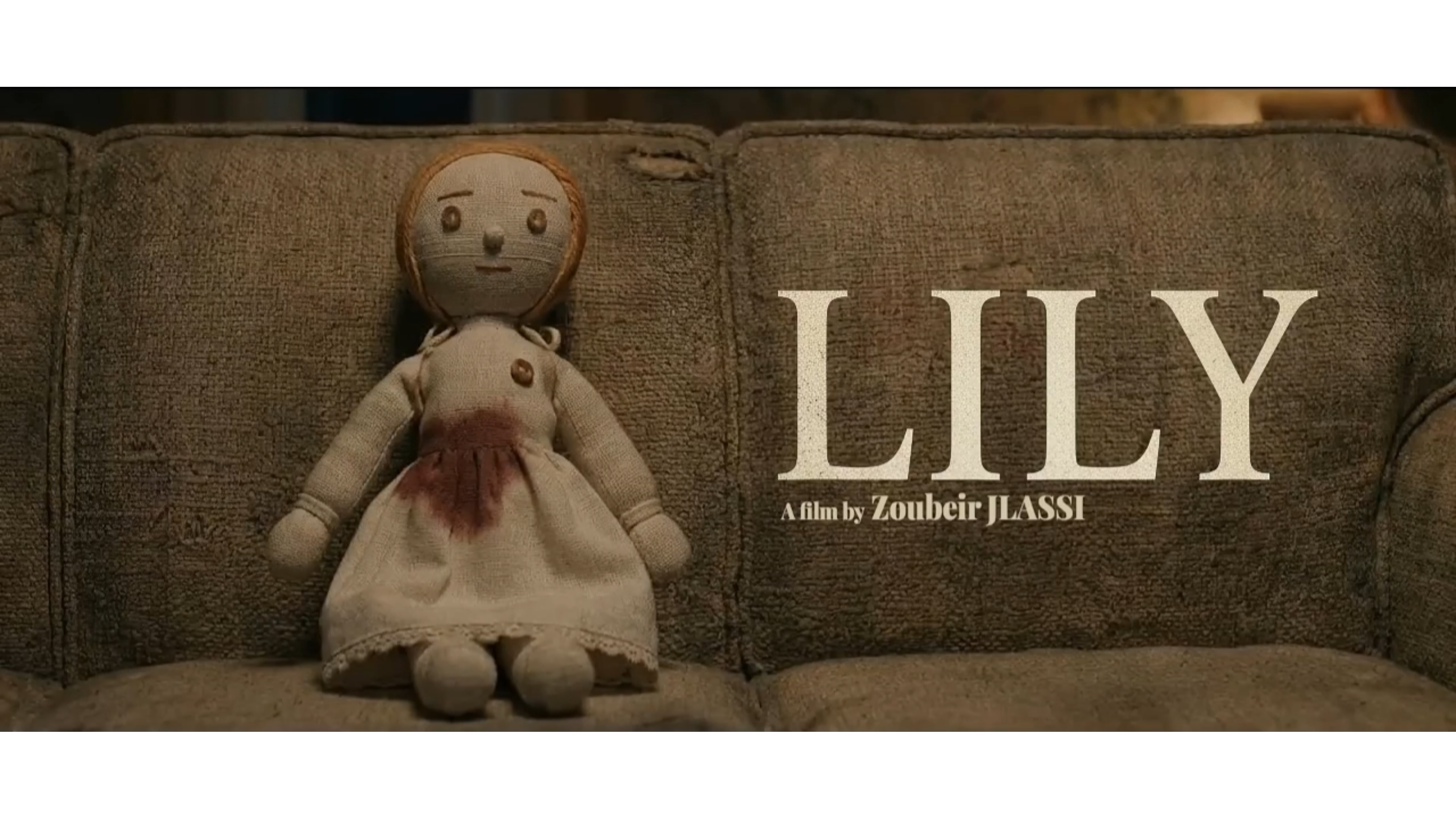 Still from LILY showing archivist with doll in rain-soaked cityscape
