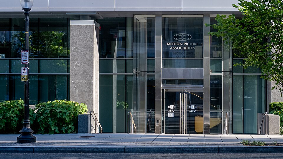 Motion Picture Association headquarters entrance with signage above the glass doors