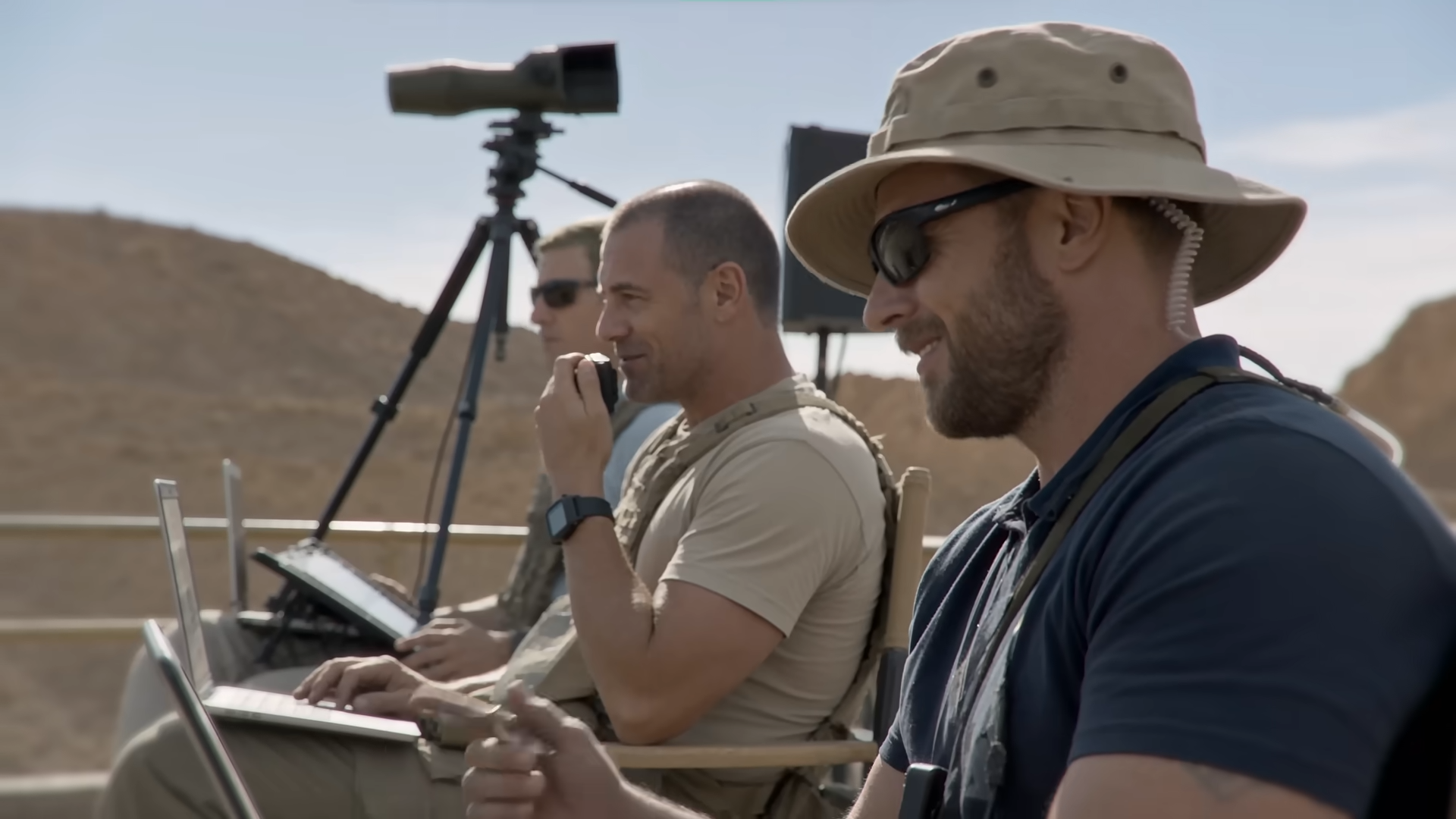 Military personnel in a desert environment operating equipment in a scene from Nightborne