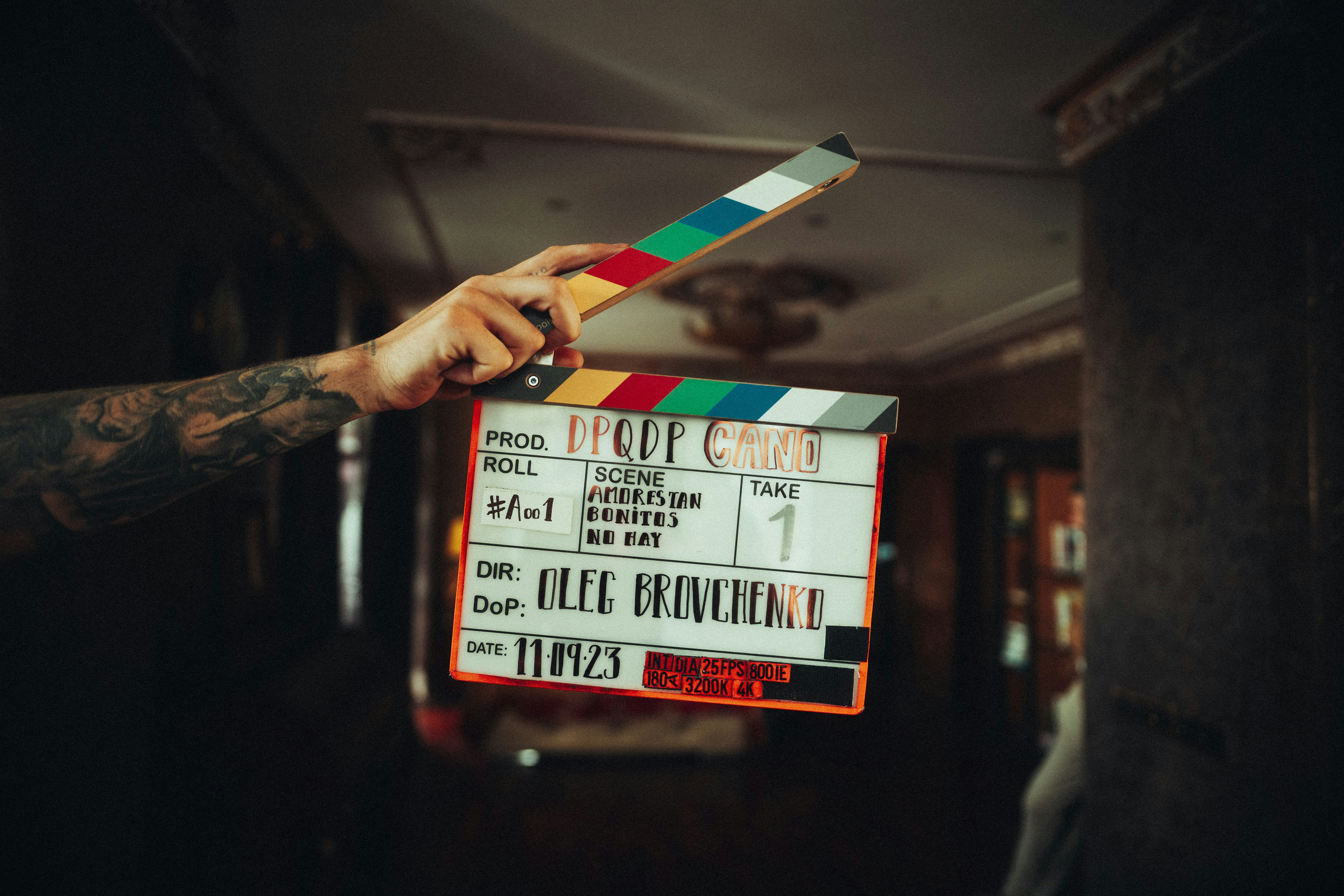 Film clapperboard in hand during production