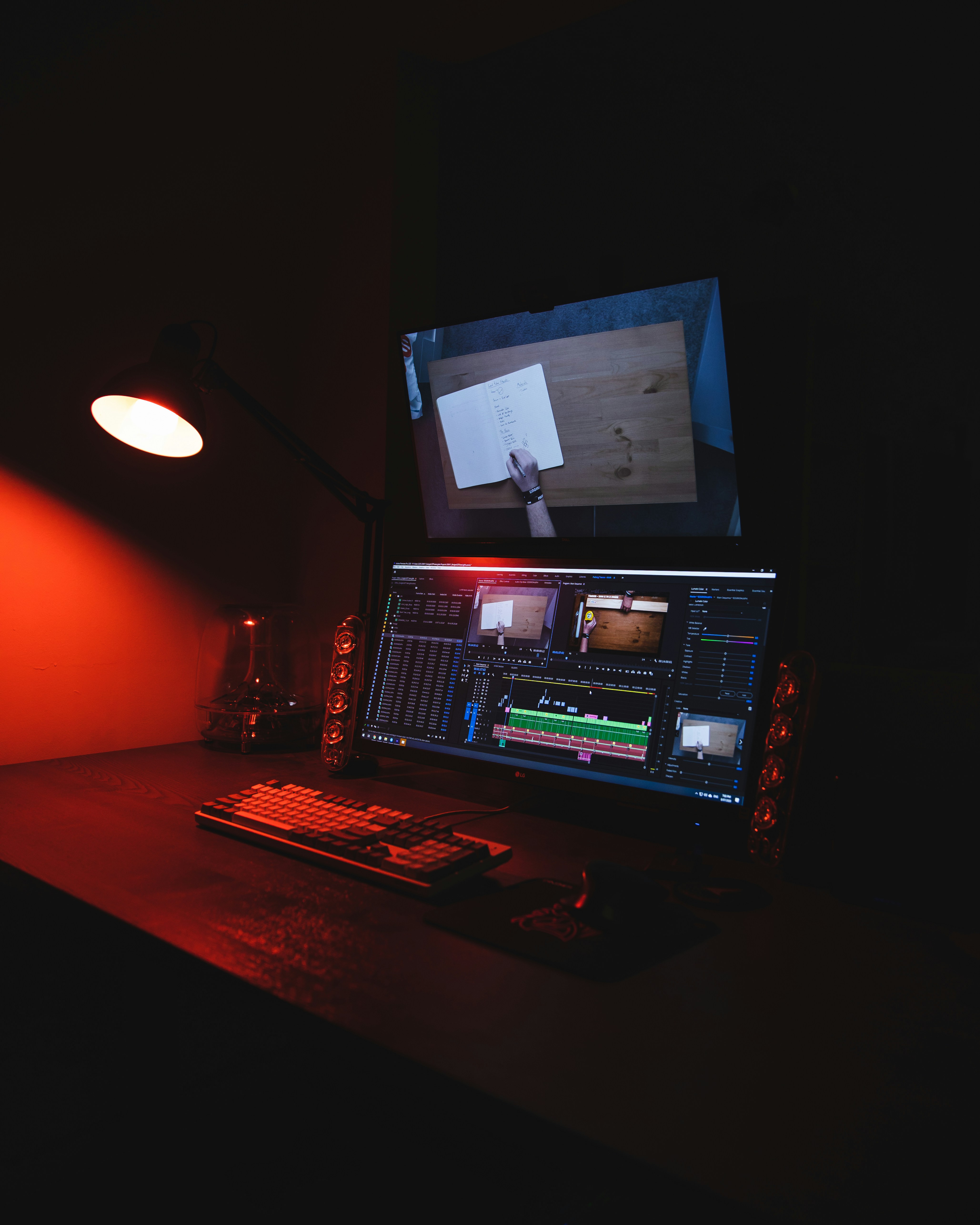 Video editing workspace with multiple screens showing timeline