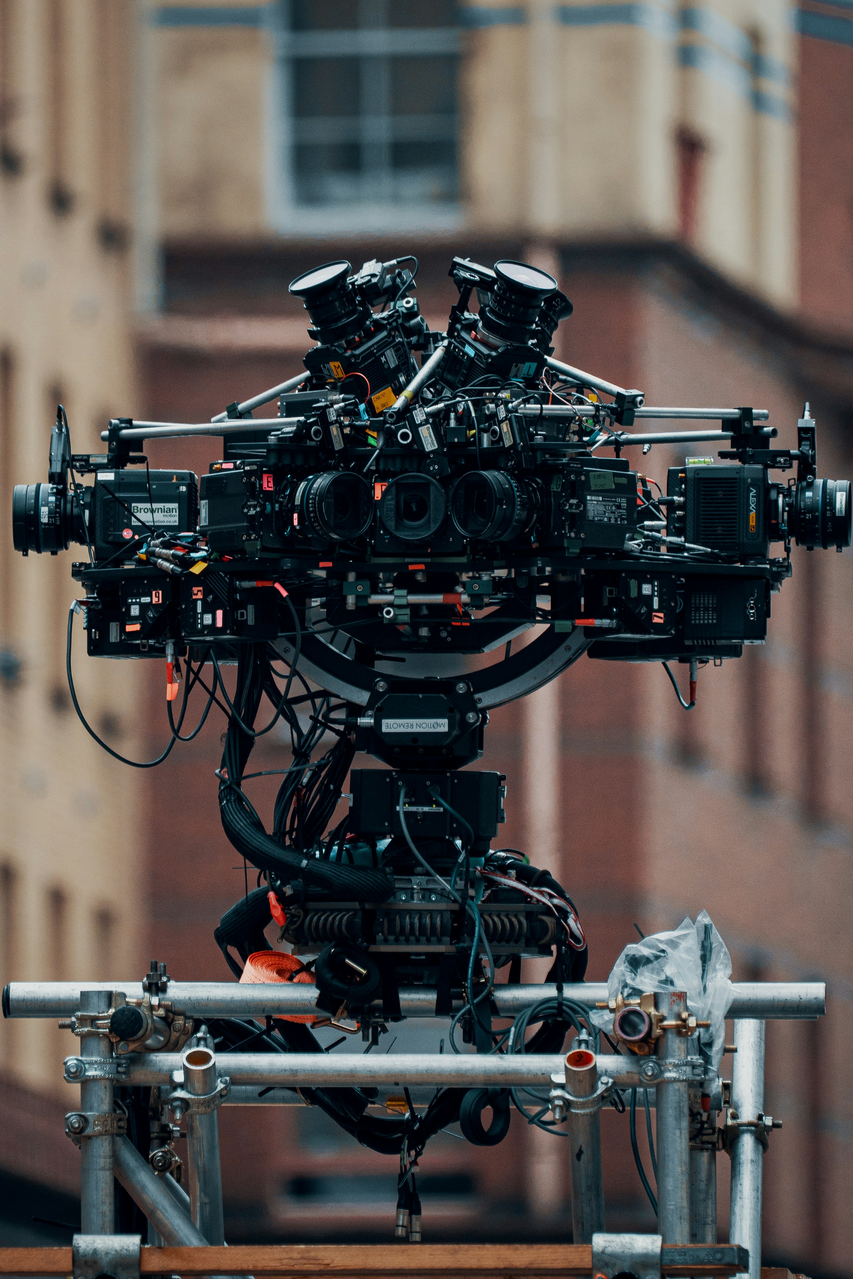 Complex film camera rig with multiple lenses and wires on a production set