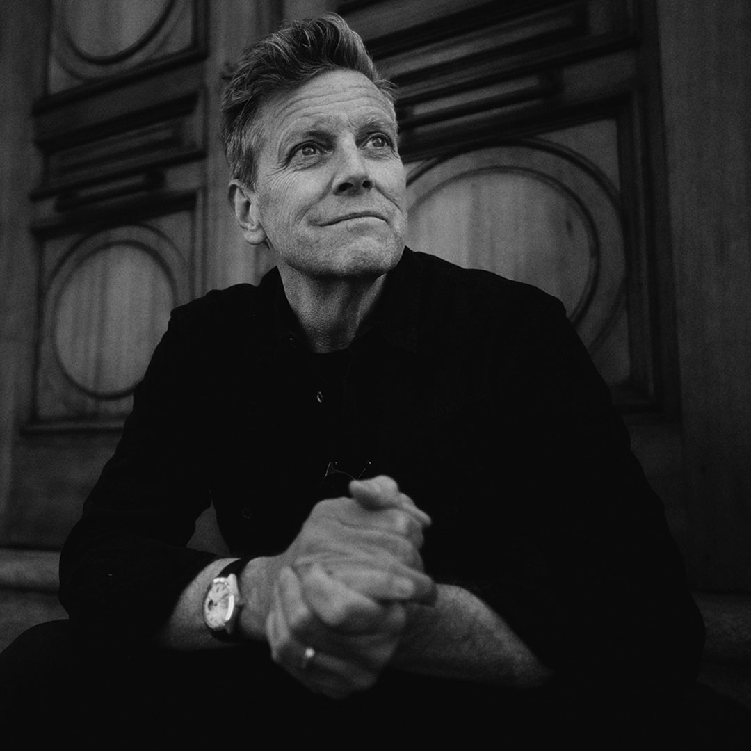 Documentary filmmaker Greg Kohs in black and white portrait