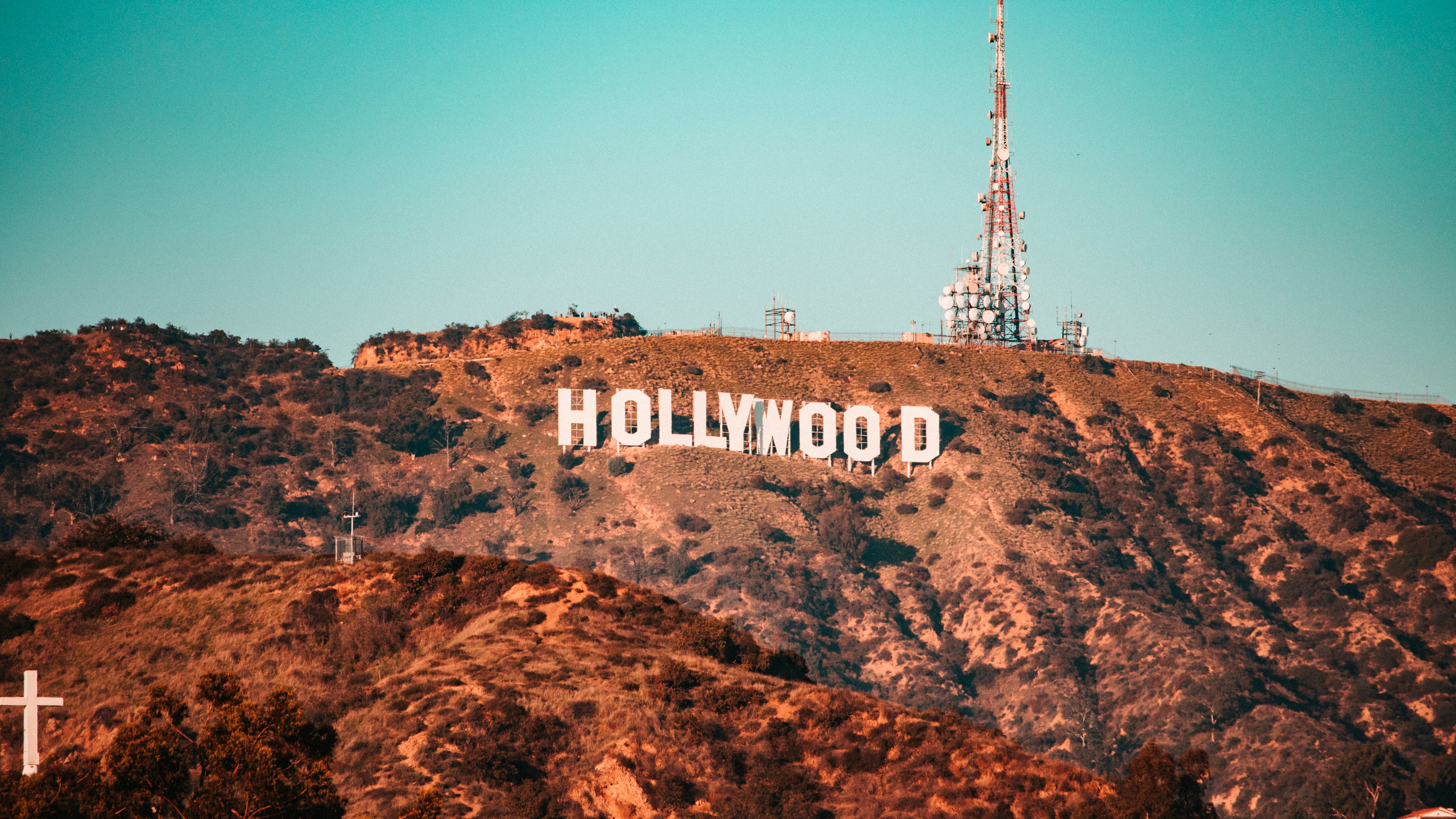 The Hollywood sign on a hillside in Los Angeles under a blue sky
